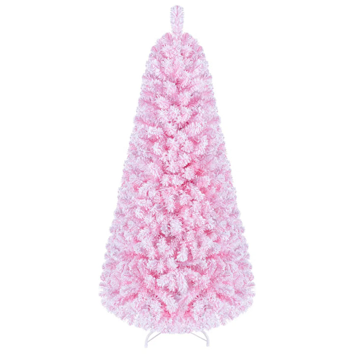 Kleine roze besneeuwde kerstboom met lichtjes
