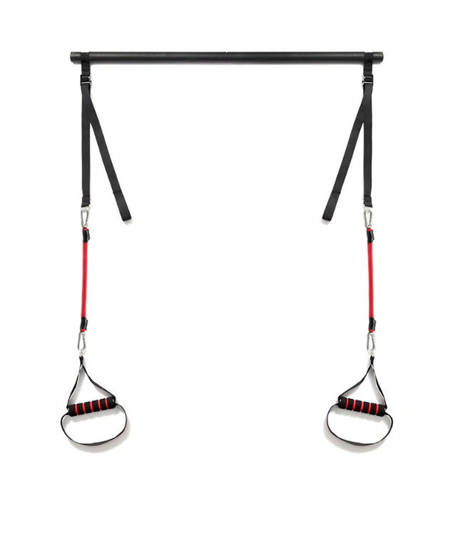 Pilates bar met weerstandsbanden op een mat