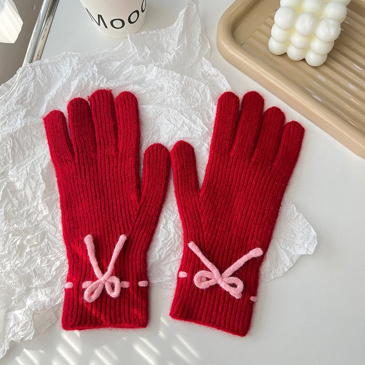Geribde handschoenen met strikje bij de pols