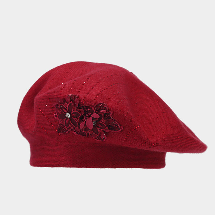 Gebreide baret met bloem en strass