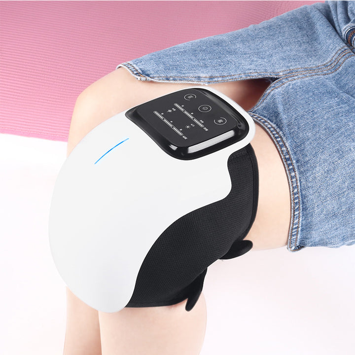 Wit draadloos massageapparaat om een knie