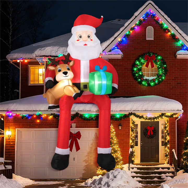 Grote opblaasbare zittende kerstman met rendier