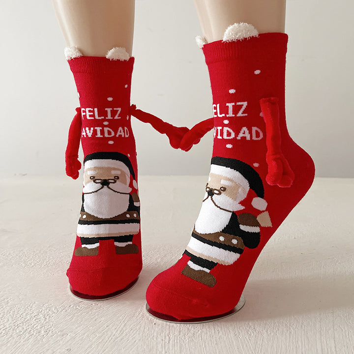 Twee kerstsokken met magnetische handjes