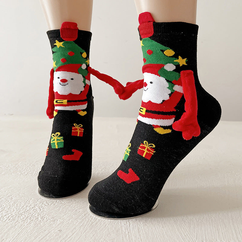Twee kerstsokken met magnetische handjes