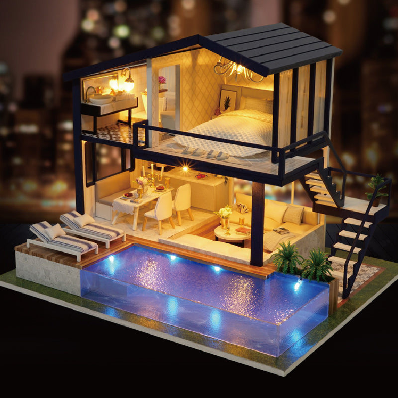 Verlicht miniatuur poppenhuis met zwembad