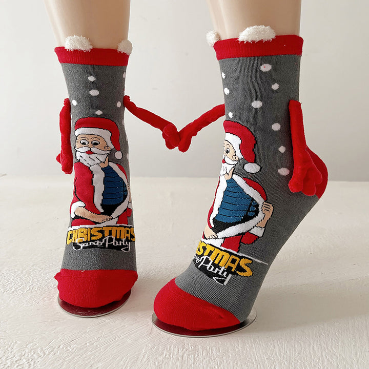 Twee kerstsokken met magnetische handjes