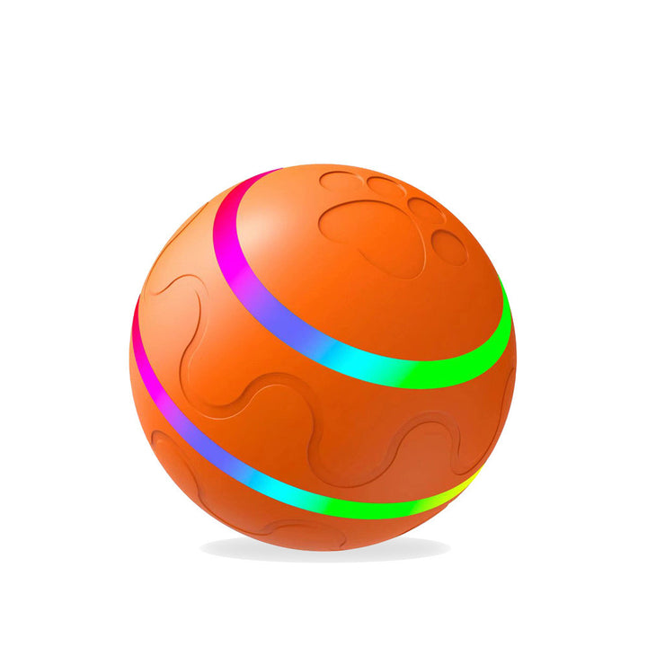 Oranje lichtgevende kattenbal op de vloer