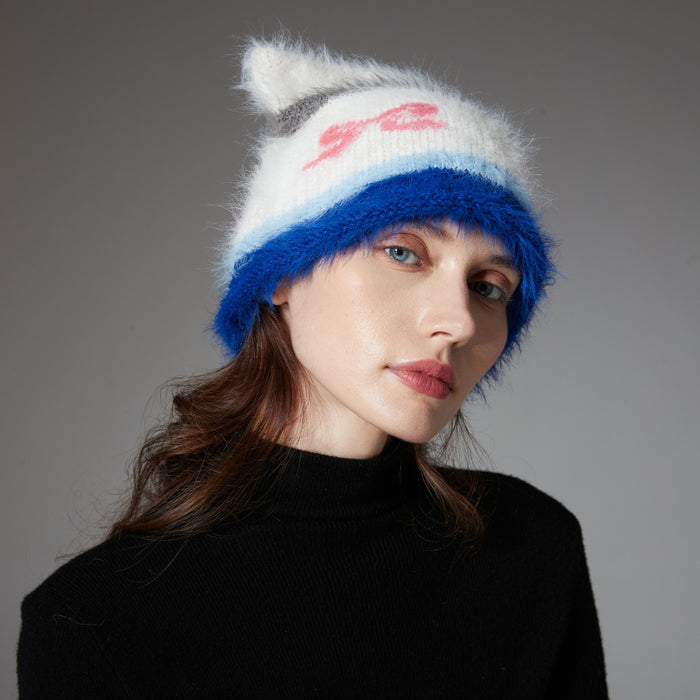 Warmteparadijs Pluizige beanie met kattenoortjes en strikjespatroon
