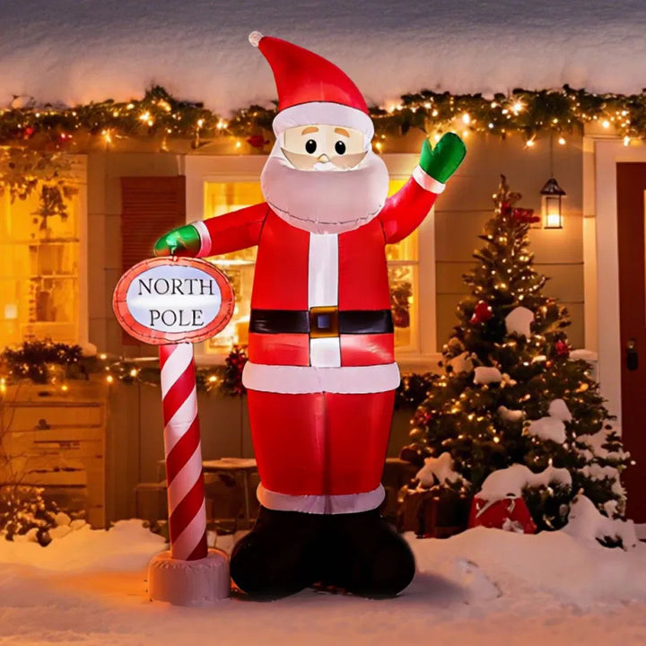Grote opblaasbare kerstman met Noordpoolbord