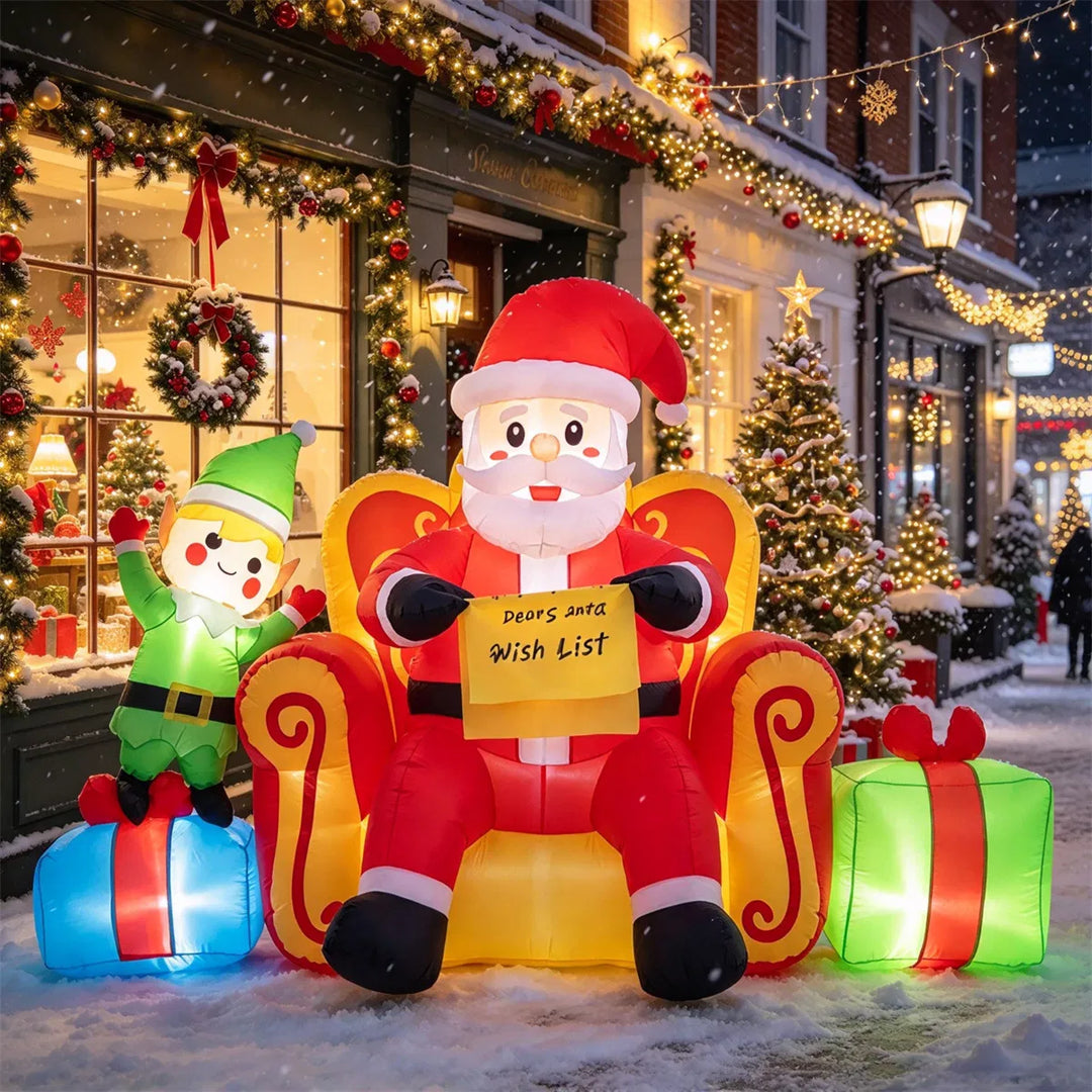 Opblaasbare kerstman op bank met elf