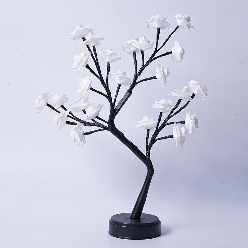 Rozenboom lamp met oplichtende roze rozen