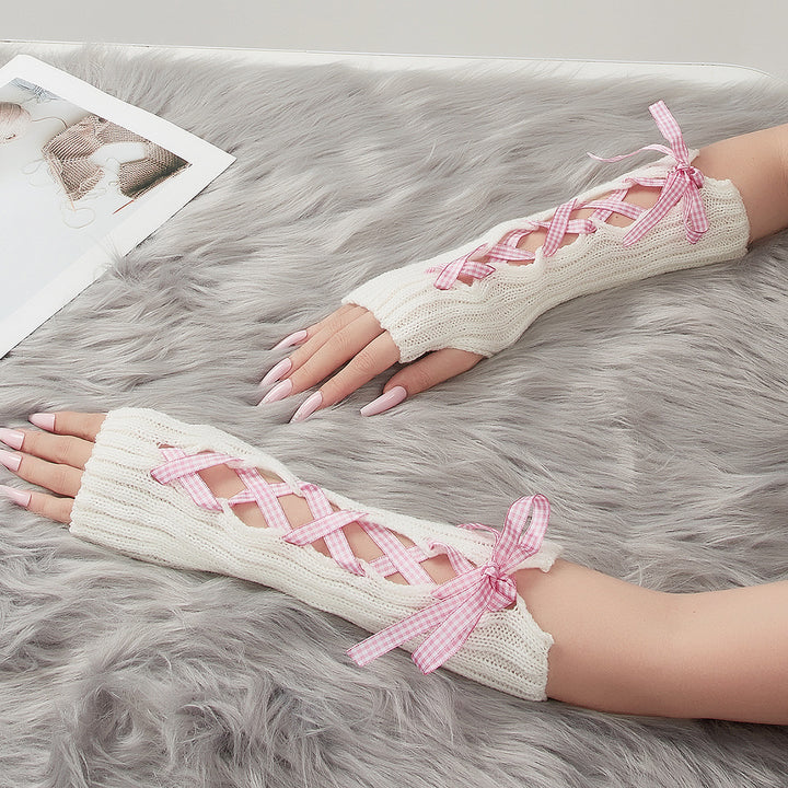 Lange witte armwarmers met geregen lint