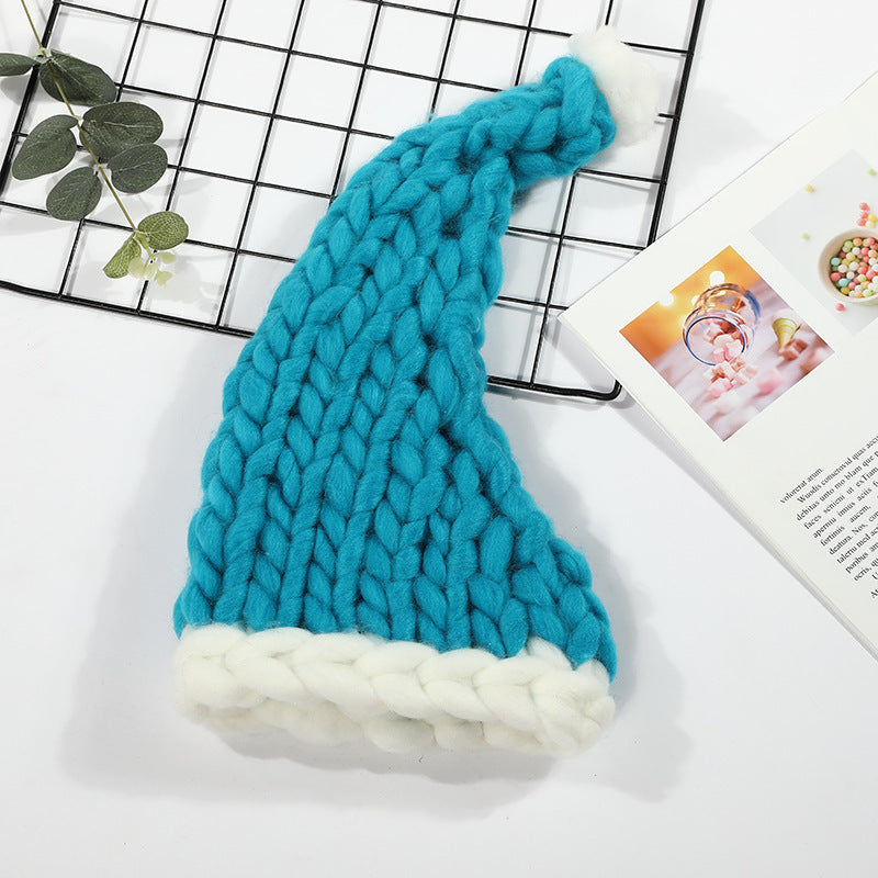 Grofgebreide rode kerstmuts met witte pompon