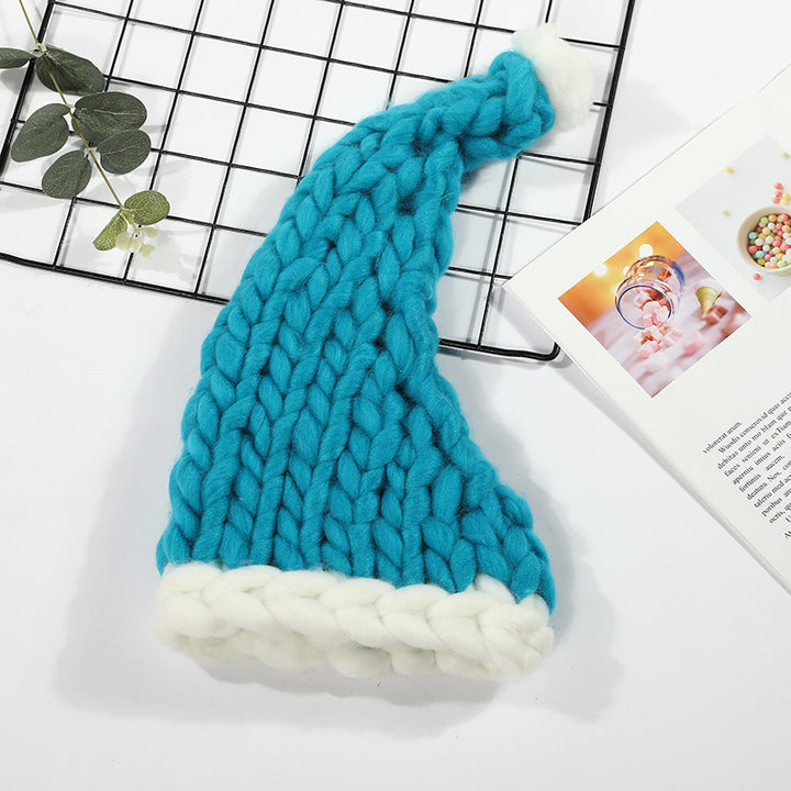 Grofgebreide rode kerstmuts met witte pompon