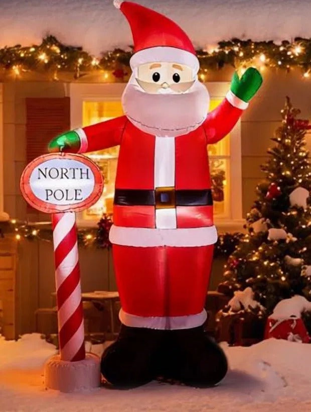 Grote opblaasbare kerstman met Noordpoolbord