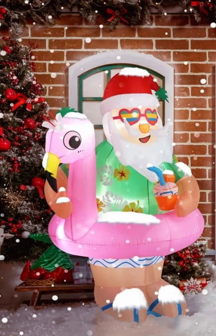 Opblaasbare kerstman op roze flamingo