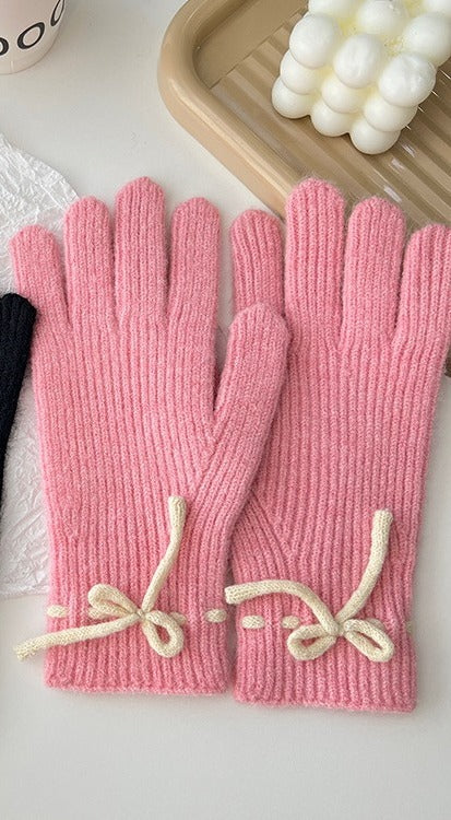 Geribde handschoenen met strikje bij de pols
