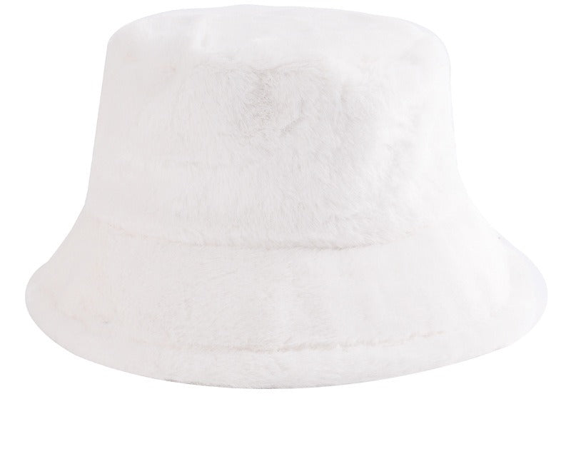 Pluizige bucket hat met koeienprint