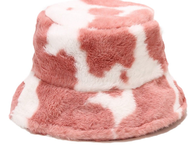 Pluizige bucket hat met koeienprint