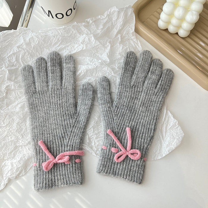 Warmteparadijs Geribde gebreide handschoenen met een strikje
