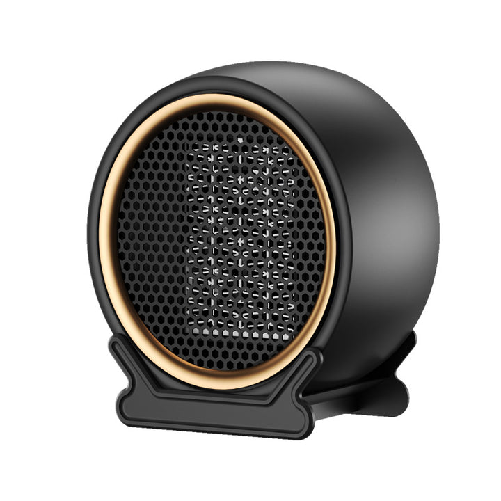 Compacte ronde ventilatorkachel op een bureau