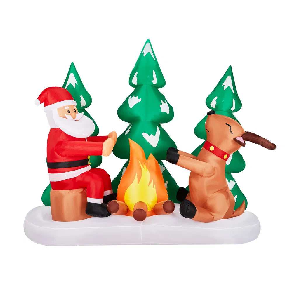 Opblaasbare kerstman bij kampvuur met rendieren