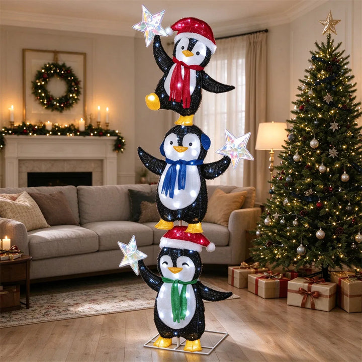 Verlichte figuur met drie pinguïns