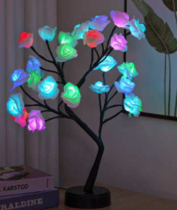 Rozenboom lamp met oplichtende roze rozen