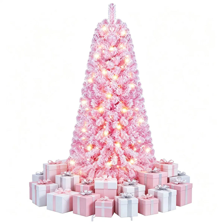 Kleine roze besneeuwde kerstboom met lichtjes